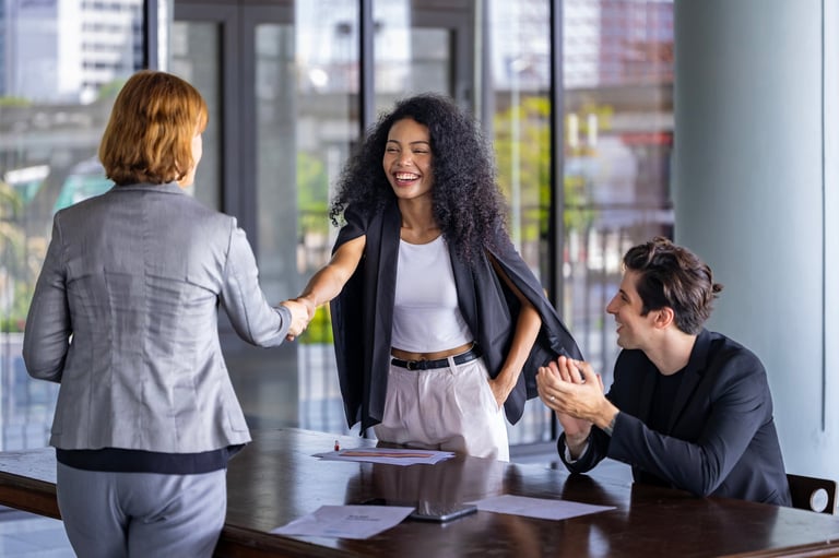 Business professionals celebrating successful investment deal